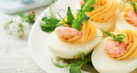 Stuffed,Or,Deviled,Eggs,Yolk,,Shrimp,,Pea,Microgreens,With,Paprika