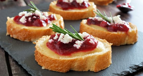 Holiday,Crostini,Appetizers,With,Cranberry,Sauce,,Brie,,Feta,And,Rosemary