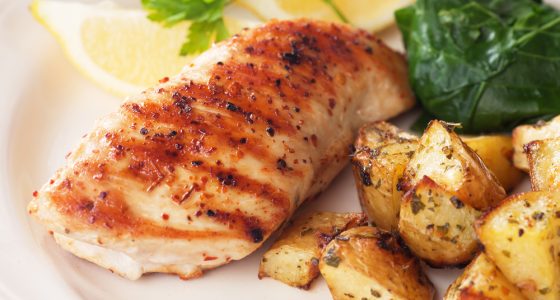 Grilled chicken breast with roasted potato and chard