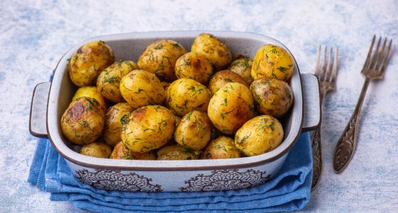 Roasted,Baby,Potatoes,With,Garlic,And,Herb,,On,Light,Background.