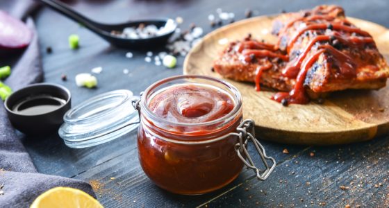 Jar,With,Barbecue,Sauce,And,Fried,Meat,On,Dark,Table