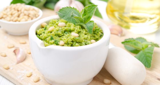 Pesto,With,Green,Peas,And,Mint,On,A,Wooden,Board,