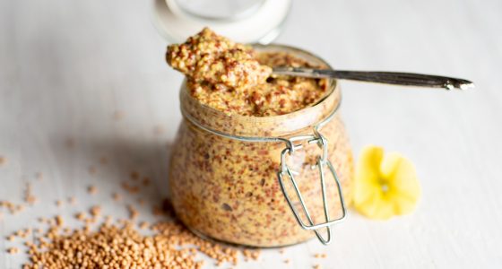 Wholegrain,Mustard,In,A,Jar,On,A,Table,Closeup